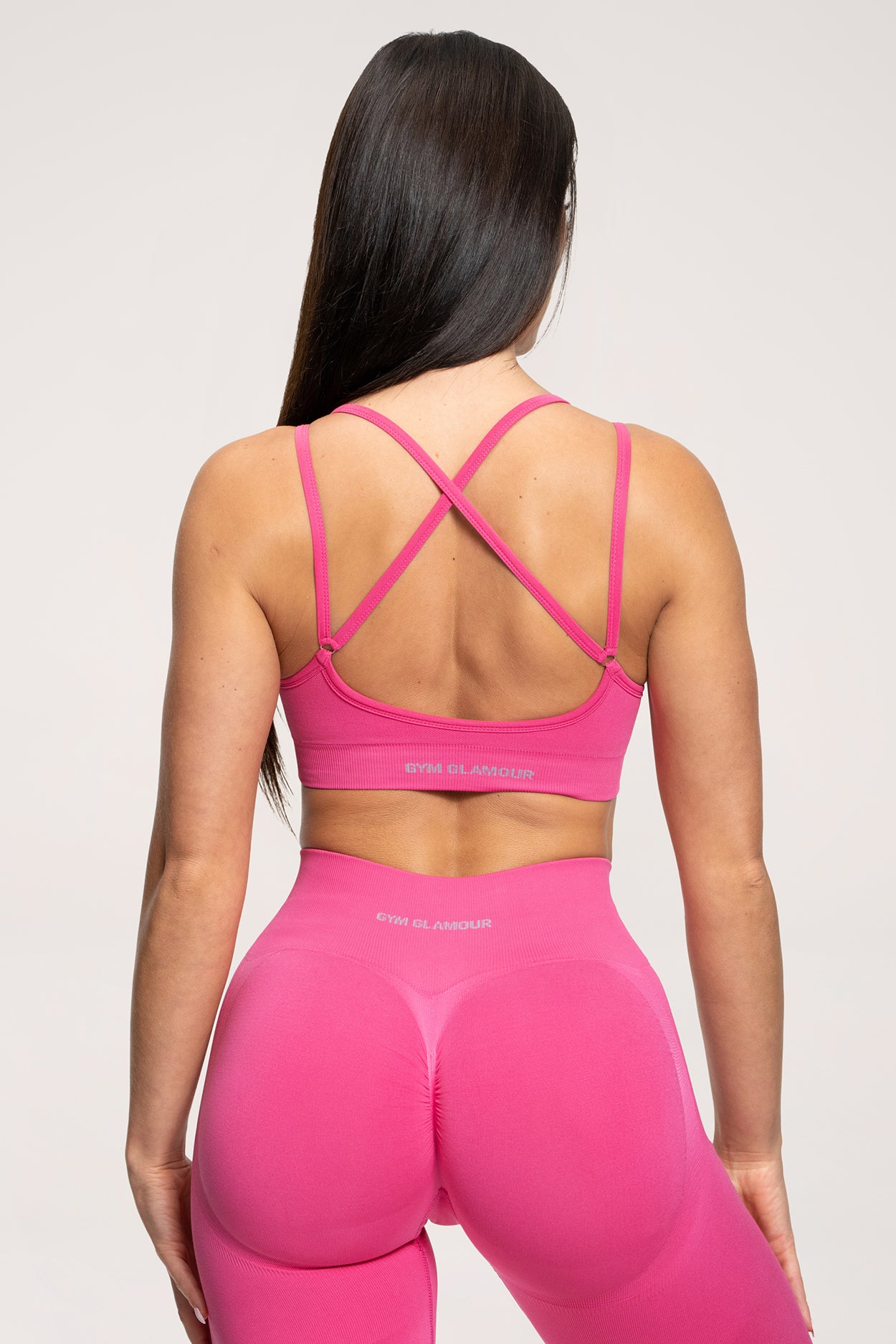 Fake BBL sports bra hot pink